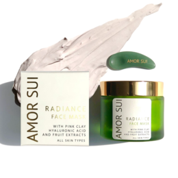 Radiance face mask made of soft, breathable material in a light beige color. Features a green cap and label with the brand name "Amor sui" printed on it.