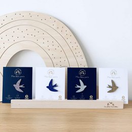 Glitter swallow brooch in silver, blue, gold, and multicolor. Decorative metal pins with a stylized bird design.