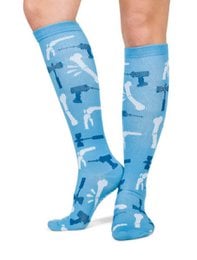 Compression socks in a light blue color with a pattern of orthopedic and traumatology-related icons and symbols.