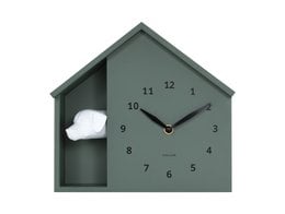 "House-shaped wall clock with peeking dog, sage green color, cute animal design, modern home decor"