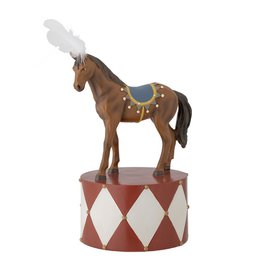  A decorative red, brown, and white polyresin statue of a horse on a circus-themed pedestal.

The image shows a decorative polyresin statue of a horse in a reddish-brown color. The horse is standing on a pedestal with a circus-themed design, featuring diamond patterns in red and white. The statue has a whimsical, vintage-inspired style that would be suitable for home decor or display.