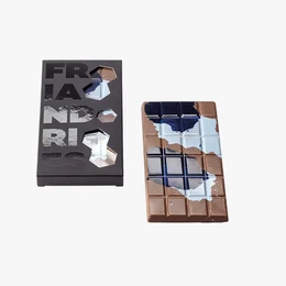 Chocolate bar with caramel, peanuts, and a dark chocolate coating.