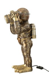  Antique brown table lamp made of polyresin in the shape of a diver figure.