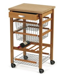 A wooden kitchen storage cart with a wooden top, wire baskets, and shelves for storing kitchen items.