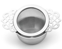 Stainless steel tea strainer with drip tray, low profile design for easy storage.