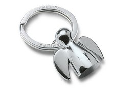 Silver-toned keychain in the shape of an angel figure, suitable for holding keys or attaching to bags.