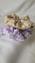 Seersucker scrunchie in taupe and lilac colors, featuring a textured fabric pattern and a soft, scrunchie design for comfortable wear.