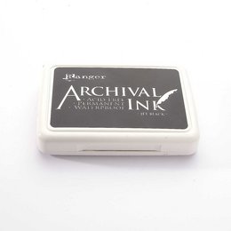 Rectangular black ink pad for archival stamping and printing. Features a solid black ink surface with a circular pattern of raised dots around the edge.