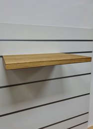 Wooden wall-mounted shelves for pet toys, featuring a simple, minimalist design with natural wood tones.