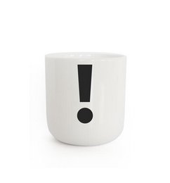 A white ceramic mug with a bold black exclamation point graphic. The mug has a simple, minimalist design that would complement a variety of home decor styles.