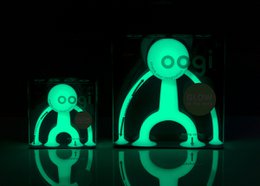 Glow-in-the-dark sensory toy figure with flexible, bendable limbs in a vibrant green color.