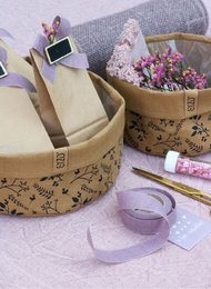 Natural washable paper storage baskets with black floral print, available in various sizes from 13x13 cm to 25x10 cm. Made of biodegradable and waterproof materials.