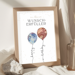  Framed A4 poster featuring colorful balloons with the German text "Wunscherfüller" (Wish Fulfiller). The poster is a creative gift idea to frame cash or money as a birthday or other special occasion present.