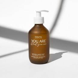 Natural hand soap with a pump dispenser. Amber-colored liquid with a simple, minimalist design.