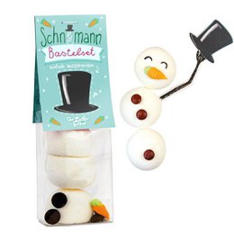 Snowman-themed snack bag with assorted candies and decorative elements. Includes round white marshmallows, black licorice pieces, and a plastic top hat accessory.