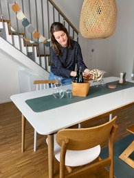 A modern, minimalist table runner in neutral tones of nordic pine, cloudy gray, ivory coast, oak wood, and mint leaf. Suitable for a variety of home decor styles.
