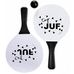 A set of two white beach balls with black text and graphics. One ball says "JUF" and the other says "ZINE". The set also includes a black paddle.