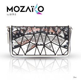 A black and white geometric patterned handbag with a chain strap, suitable for formal or casual wear.