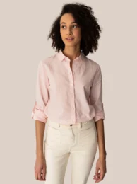 A lightweight, button-up blouse in a soft pink color. Features a classic collar, long sleeves with button cuffs, and a relaxed, feminine silhouette. Suitable for a variety of casual and semi-formal occasions.