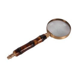  A wooden magnifying glass with a brass frame, used as a desktop organizer.