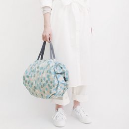 A compact, foldable shopping bag in a hailstone (arare) pattern. The bag is made of durable, water-resistant material and features a spacious interior and sturdy handles for easy carrying.