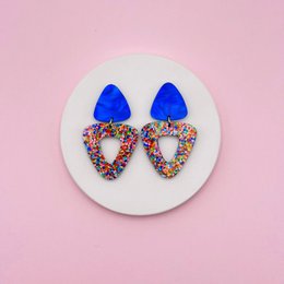  Blue drop earrings with colorful confetti heart shape, statement jewelry, vibrant multicolor design.