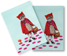 Colorful postcard featuring a whimsical illustration of a cat wearing a red hooded cape and carrying a basket, standing on a polka dot background.