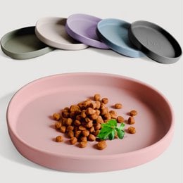 The image shows a set of colorful silicone feeding bowls in various pastel shades, including rose, green, blue, graphite gray, lilac, and stone gray. The bowls appear to be designed to be pet-friendly, with a "whisker friendly" feature mentioned in the product title. The image also shows a pink plate with some food items on it, such as what appears to be roasted chickpeas or a similar snack.
Based on the information provided, the relevant description for this product would be:
"Silicone feeding bowls in a variety of pastel colors including rose, green, blue, graphite gray, lilac, and stone gray. Designed to be whisker-friendly for pets. Durable, non-slip, and easy to clean silicone construction."
This description covers the key details about the product, including the materials, colors, and features, which would be relevant for a semantic search related to pet feeding bowls.