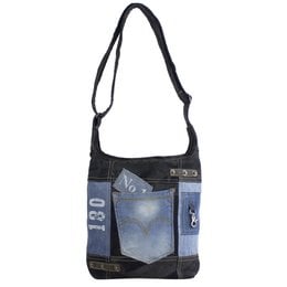 A large, light fabric shoulder bag made from recycled jeans and canvas. The bag has an adjustable handle and a zipper closure, and is suitable for ladies and girls.