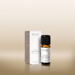 "Essential oil blend, small glass bottle, black cap, golden amber liquid, natural aromatherapy, stress relief"