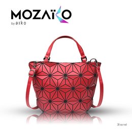 A red geometric patterned handbag with a structured silhouette and a detachable shoulder strap.
