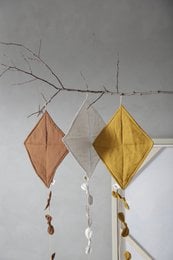 Decorative kites in various colors including blue, white, brown, and mustard. The kites have a simple, geometric diamond shape design.