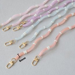  Pastel phone chain with beaded design, pink blue white, gold hardware, adjustable strap accessory.