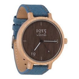 A round, wooden watch with a blue denim strap. The watch face features the text "1915 watches" and the number 19.