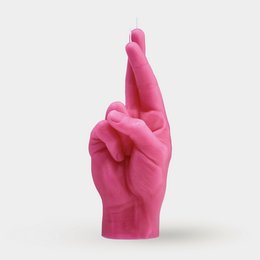 A tall, round, pink candle in the shape of crossed fingers.
