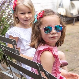 Two pink hair bows with a white background and the text "Ribbies" on the image.