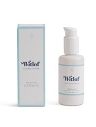 Pure Argan Oil face oil in a white bottle with a blue and white label. The oil is a light golden color and has a natural, nourishing formula.