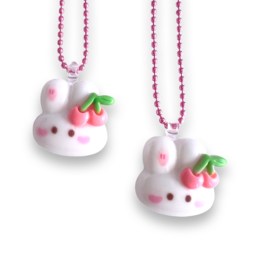 Cute white bunny necklace with cherry accents, perfect for kids. Soft, round shape with pink beaded chain.