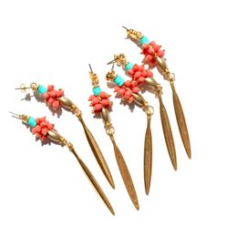 COCORNÁ long and elegant golden earrings with coral