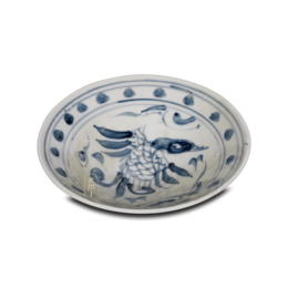 Oval-shaped decorative bowl with blue and white patterned design featuring a fish-like creature.