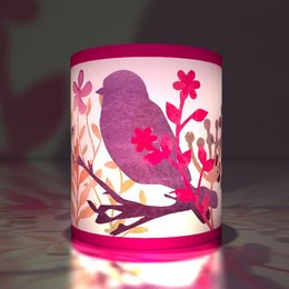  Decorative tea light holder with purple bird silhouette and floral design, suitable for summer nights.
