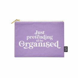 A lavender-colored makeup pouch with the text "Just pretending to be organised" printed on it. The pouch appears to be made of a soft, fabric-like material and has a zipper closure.