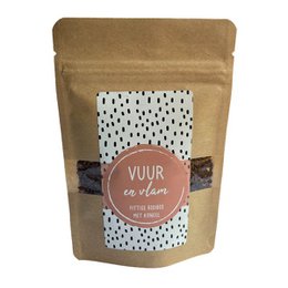  Rooibos tea with a natural, earthy flavor. Packaged in a kraft paper bag with a printed label featuring a polka dot pattern.