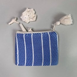 Small handmade blue and white striped clutch bag with tassels.