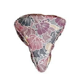 Saddle pad with a floral pattern in shades of pink, gray, and white. The pad has a triangular shape and appears to be made of a soft, textured material.