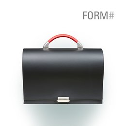 A black leather briefcase-style laptop bag with a red handle and silver accents. The bag has a rectangular shape and appears to be made of high-quality materials.