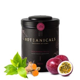 A blend of sencha green tea, turmeric, and passion fruit, presented in a black tin with a pink label. The tea leaves are visible, along with pieces of turmeric and passion fruit.