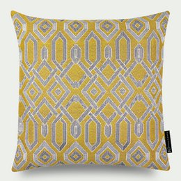 A decorative cushion with a geometric pattern in shades of yellow and gray.

The cushion features a bold geometric pattern in shades of mustard yellow and light gray. The pattern consists of interlocking diamond shapes and hexagons, creating a visually striking and textured design. The cushion would be a stylish addition to a modern or contemporary living space.