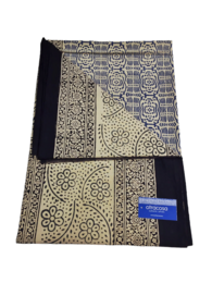 A rectangular throw blanket with a patchwork design featuring various geometric patterns in black, navy, and ecru colors. The throw appears to be made of cotton and is suitable for use as a decorative accent or for warmth.