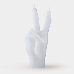 White, tall, cylindrical candle with a peace sign shape.